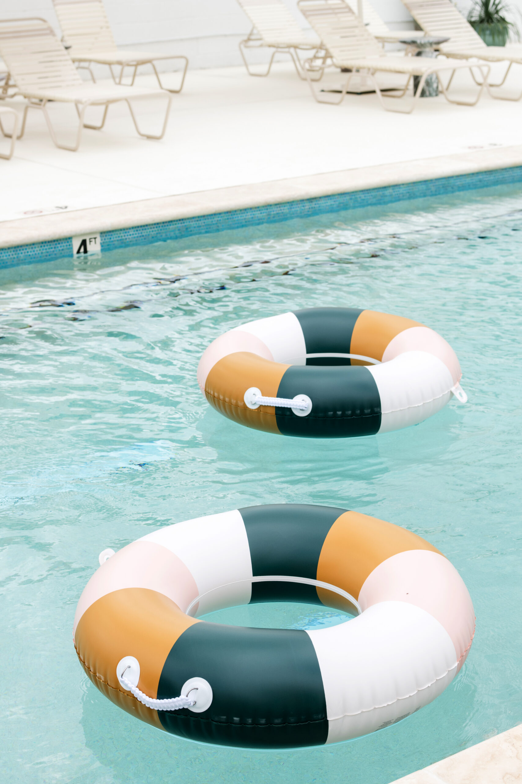 Two round floaties in a pool